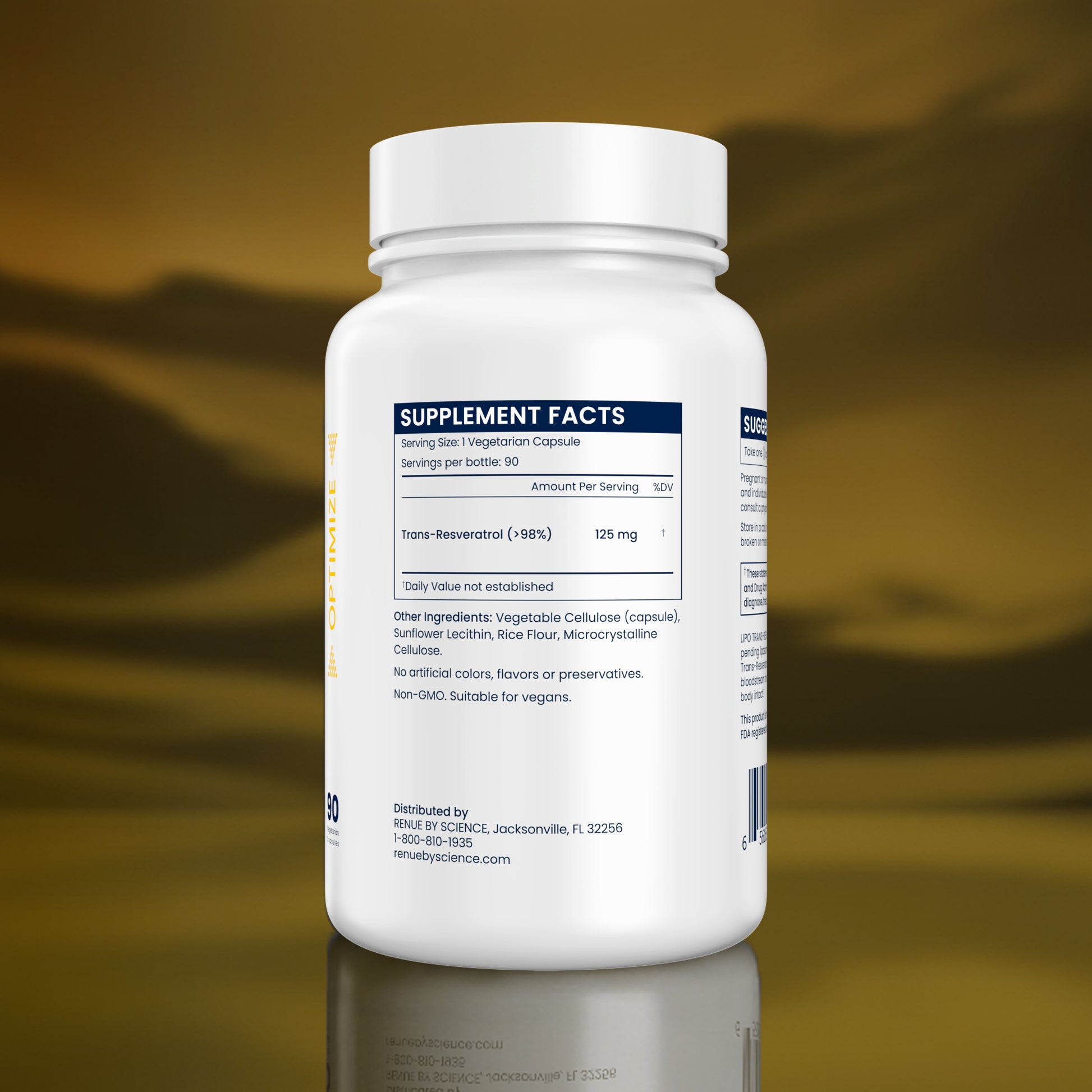 Supplement bottle with label on a reflective surface and blurred background